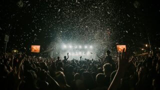 people gathering on concert field