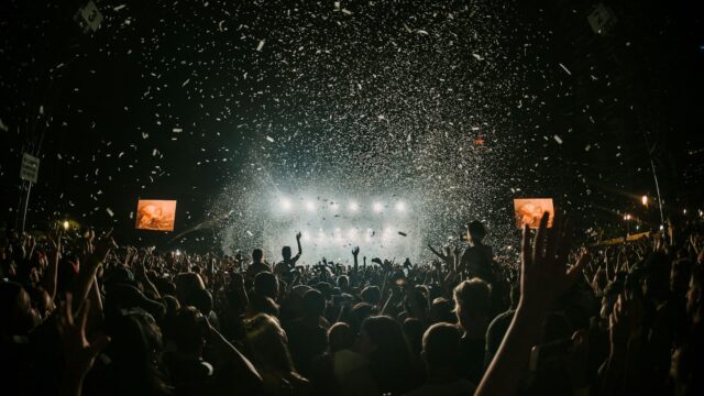 people gathering on concert field